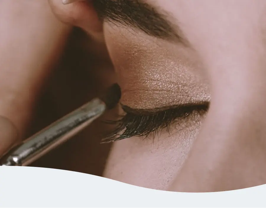 Close-up of a woman receiving an eyelash tint treatment at Pause Spa